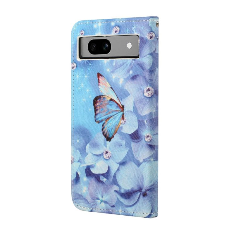 Folio-hoesje Google Pixel 8a Telefoonhoesje Blauwe Bloemen En Vlinders Met Riempje