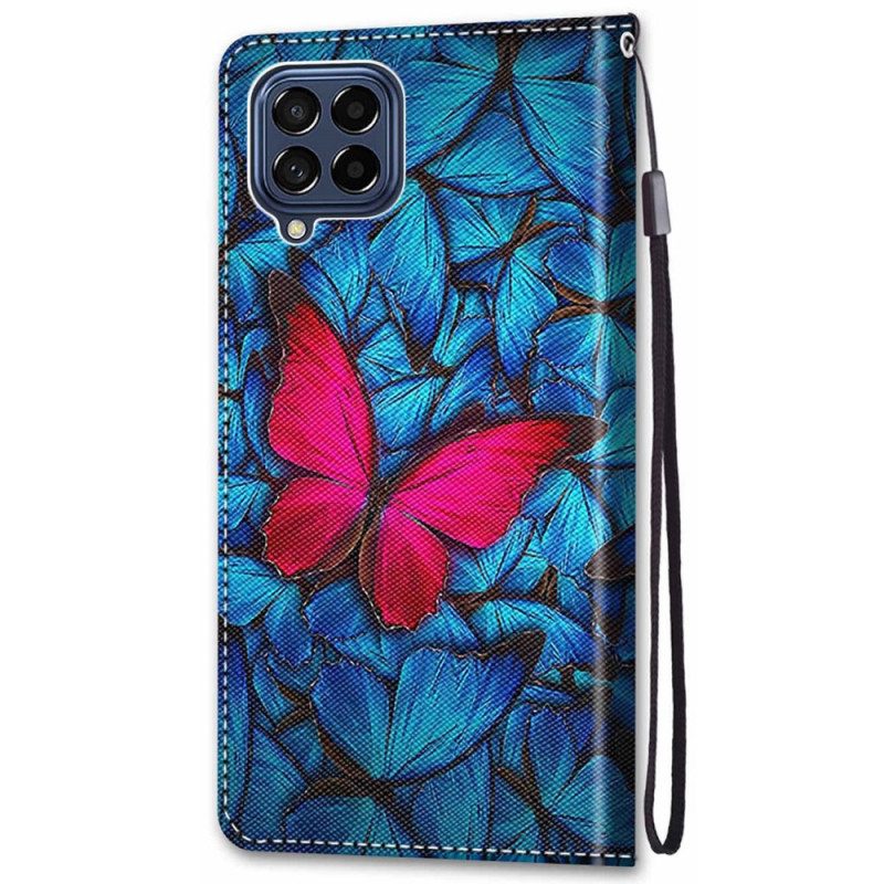 Folio-hoesje voor Samsung Galaxy M53 5G Rode Vlinder Blauwe Achtergrond