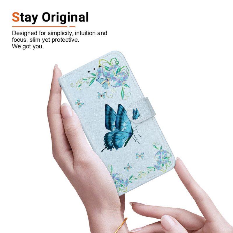 Leren Hoesje iPhone 16 Pro Max Blauwe Vlinder En Bloemen Met Riempje Bescherming Hoesje