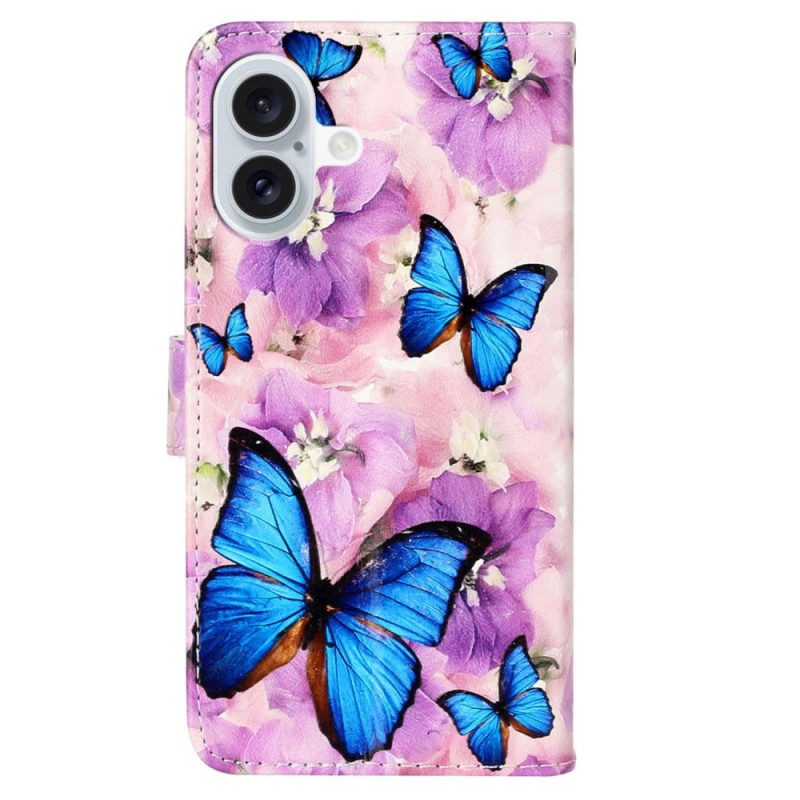 Folio-hoesje iPhone 16 Telefoonhoesje Blauwe Vlinders En Paarse Bloemen Met Riempje